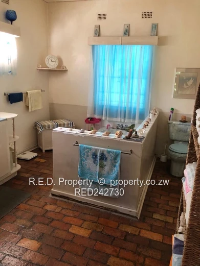 A Brick Under Tile Home In Binga